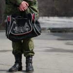 Soldier holding a bag