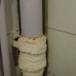 Who should repair the sewer riser in an apartment?